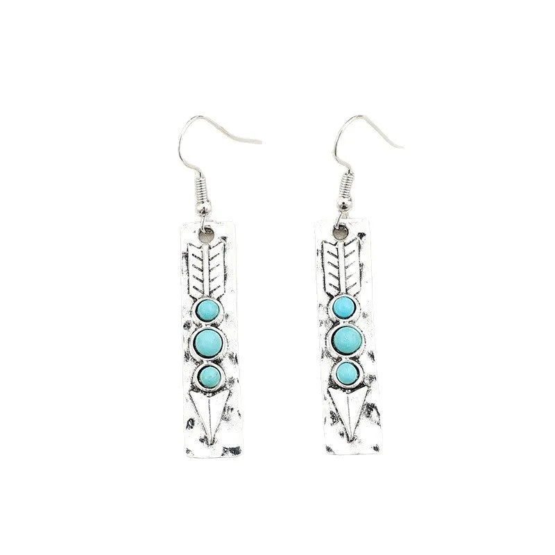 Silver long strip geometric earrings with turquoise inlay, showing front view.