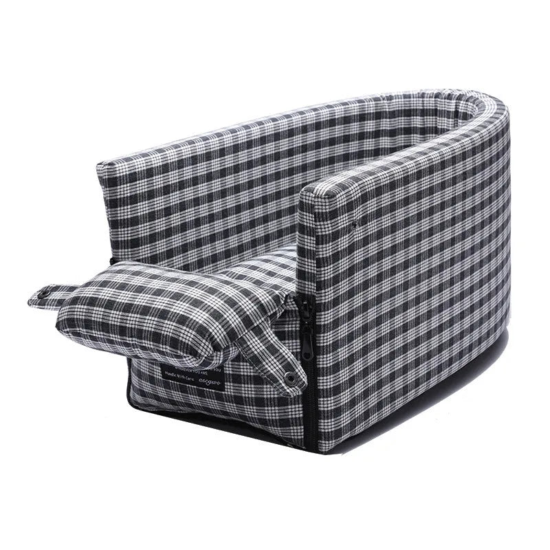 Portable pet car seat booster kennel in black grid with flip-top cover on car armrest, suitable for small dog or cat travel