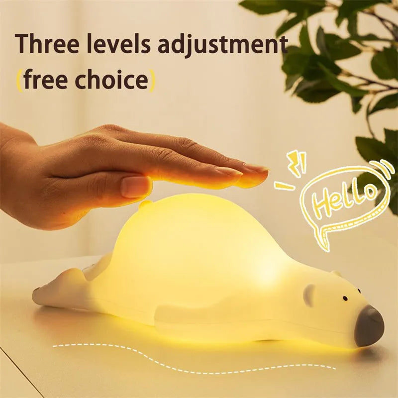 White bear silicone night light on bedside table with soft glow USB rechargeable children's lamp