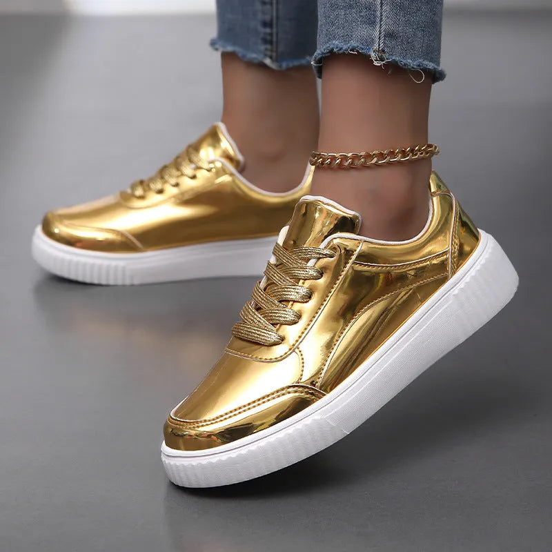 Gold sequin platform sneakers with a round toe and 3-5cm mid heel on a white background