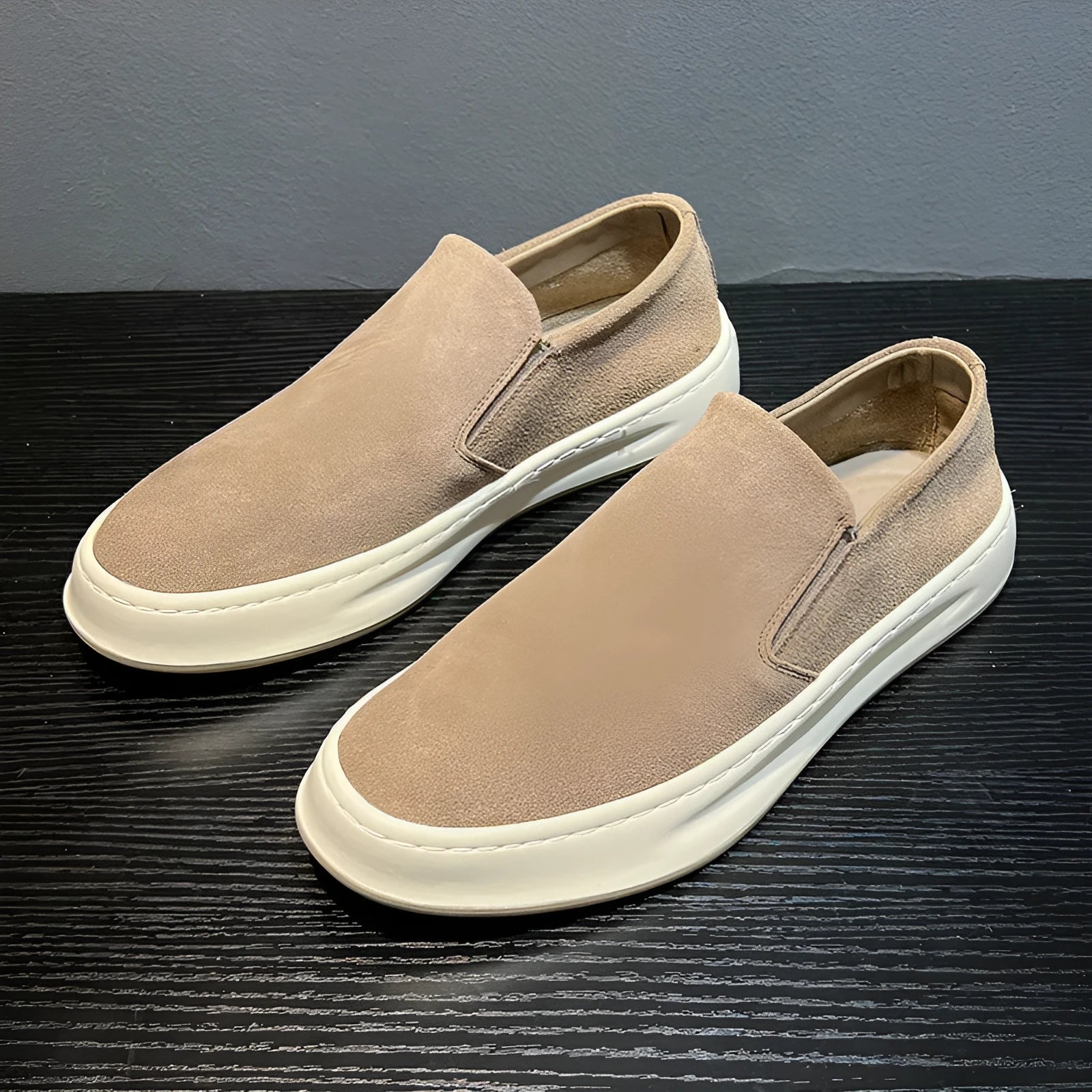 Gray men's casual slip-on shoes with round toe and mid heel on a white background