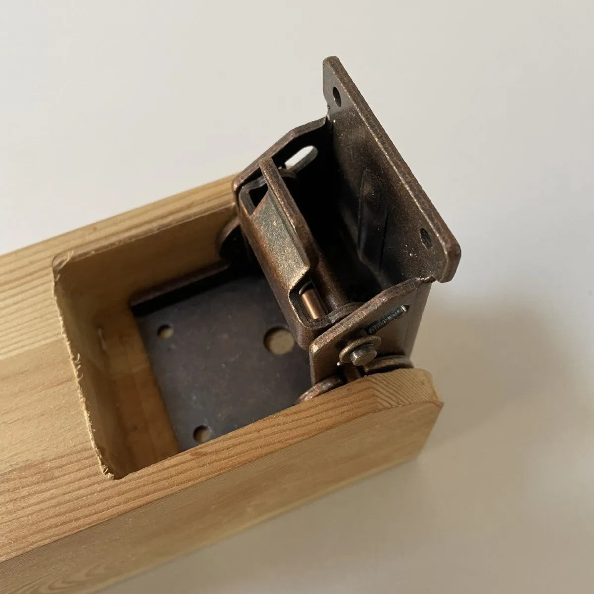 Furniture foot folding hinge in electroplated finish for invisible 0-90 degree self-locking installation.