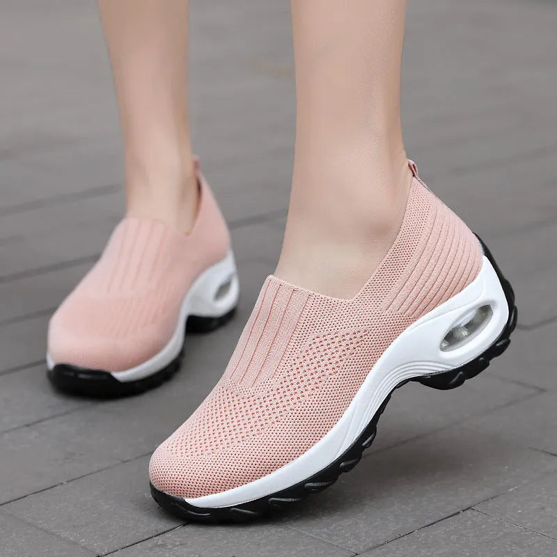 Women's mesh slip on air cushion sneakers in black, with low top and thick bottom, side view