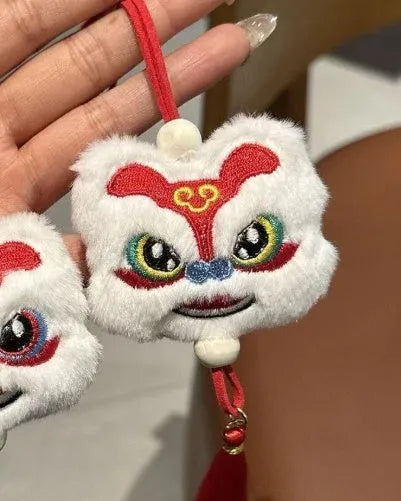 Chinese style blue plush lion keychain ornament with tassel and star stone decorative detail