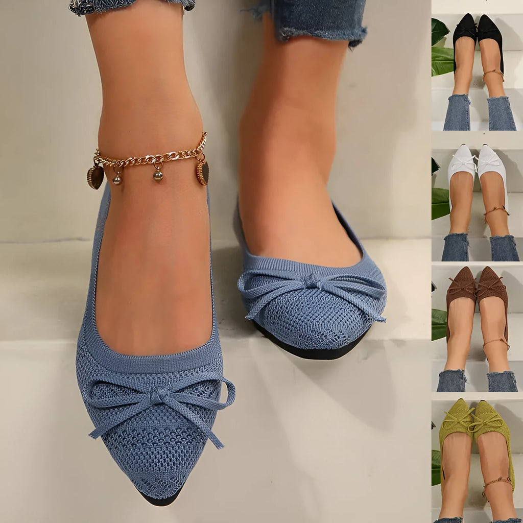 Women's knitted flat shoes with a bow detail and pointed toe in various colours on a plain background.