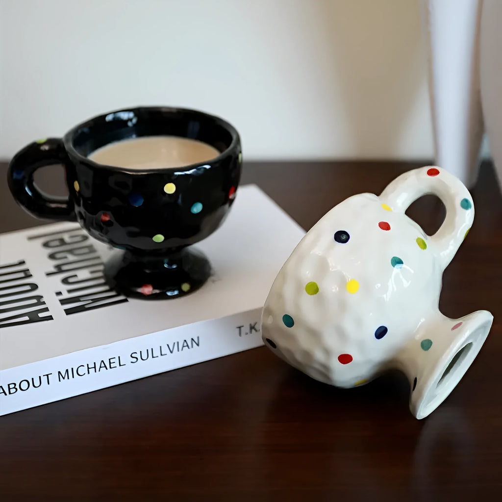 Handmade irregular solid colour ceramic mug on a table