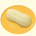 Yellow TPR peanut-shaped squeaky chew toy for dogs on a plain background.