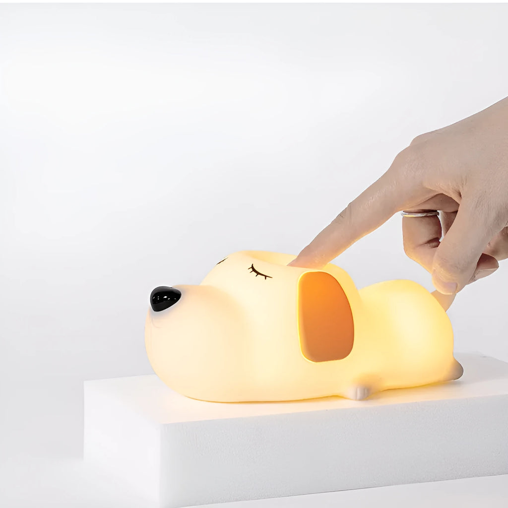 Cartoon dog design USB-charging silicone night lamp in two colours on a surface.