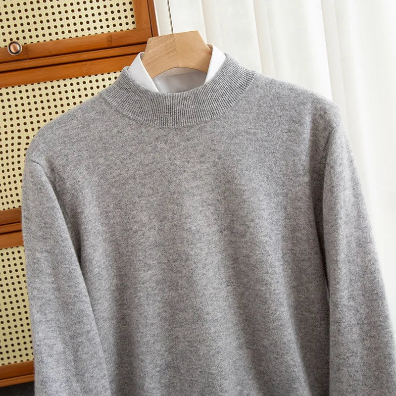 Man wearing a loose-fit half-collar wool sweater in a neutral colour, showing the knitted texture and relaxed fit.