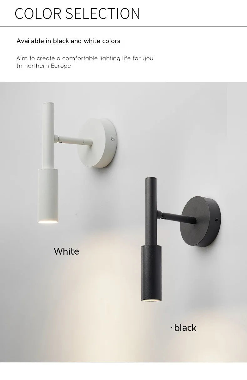 Black and white modern wrought iron wall lamp with a compact shade.