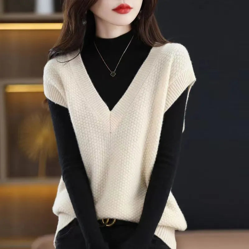 Women's creamy-white knitted vest with 3D pattern, V-neck, and sleeveless pullover design.