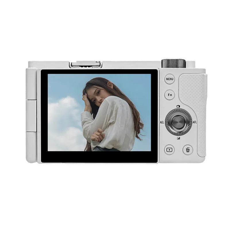 Compact digital camera in black with ultra-wide-angle lens, touch screen, and sling on a white background