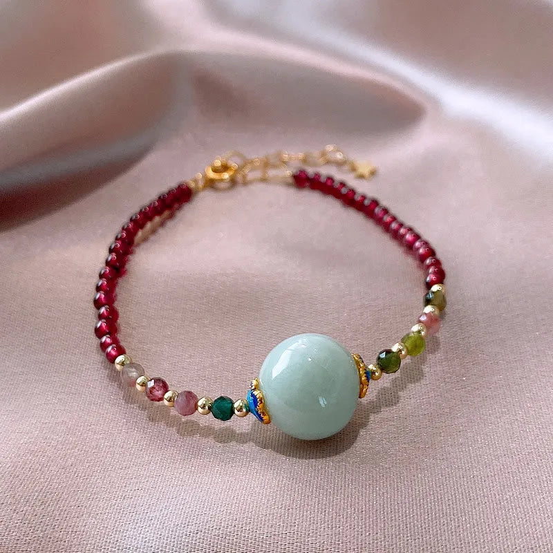 Simple aquamarine garnet bracelet with drop-shaped tourmaline stones and electroplated metal components
