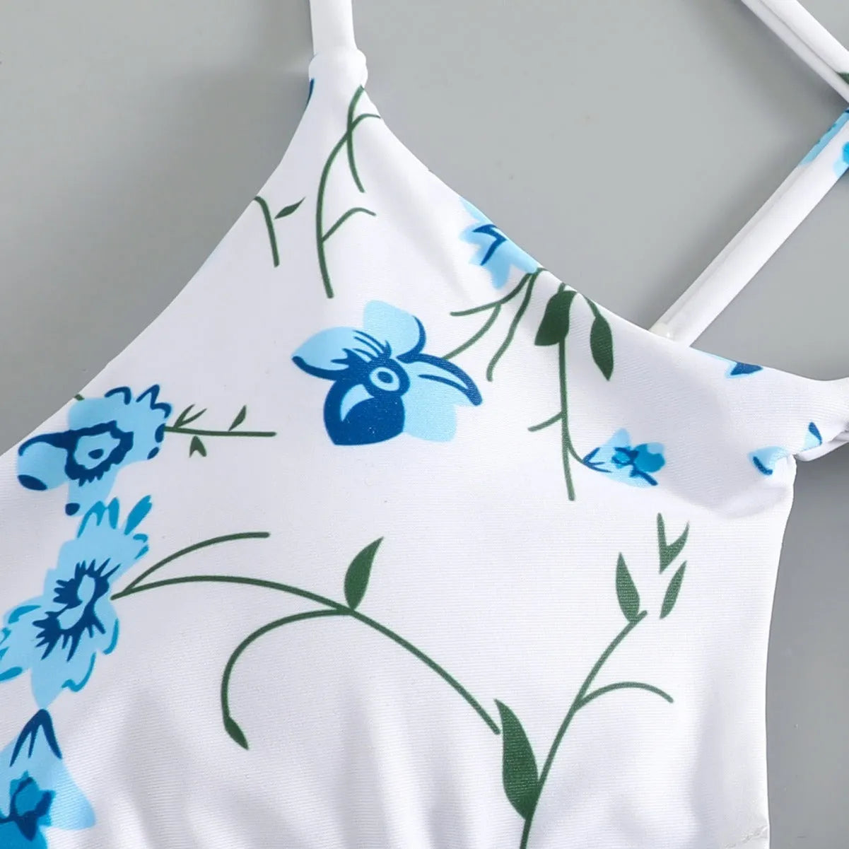 Women's floral swimsuit set with tie-neck triangle top and matching shorts