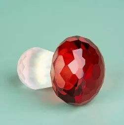 Modern geometric crystal mushroom decoration in transparent, green, red, or yellow, 40 by 53 millimetres.