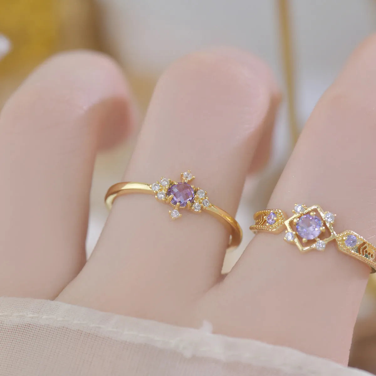 Geometric French style women's ring with purple zircon stones and open mouth adjustable design.