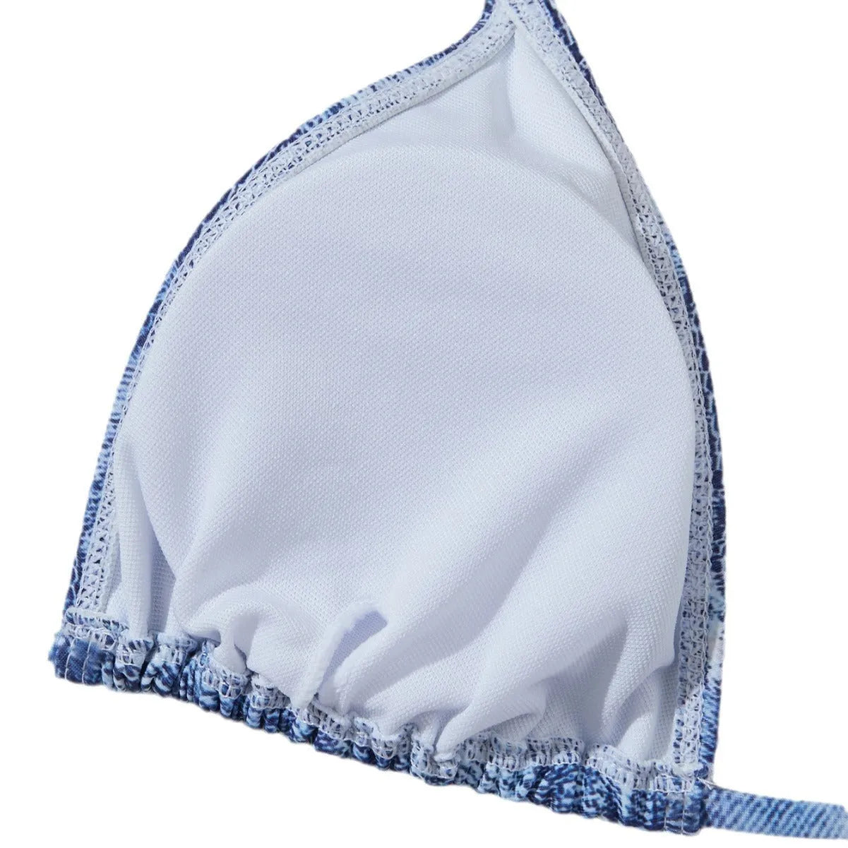 Women's denim blue printed bikini set with adjustable straps laid flat.