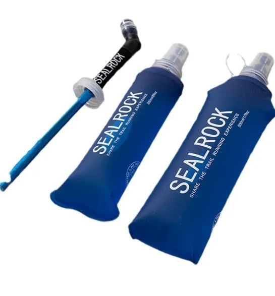 Mountain Cliking portable plastic straw with black clip attached to a green backpack strap