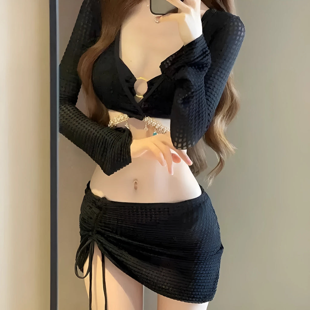 Women's long sleeve black bikini swimsuit with hot spring split style, made from polyester.