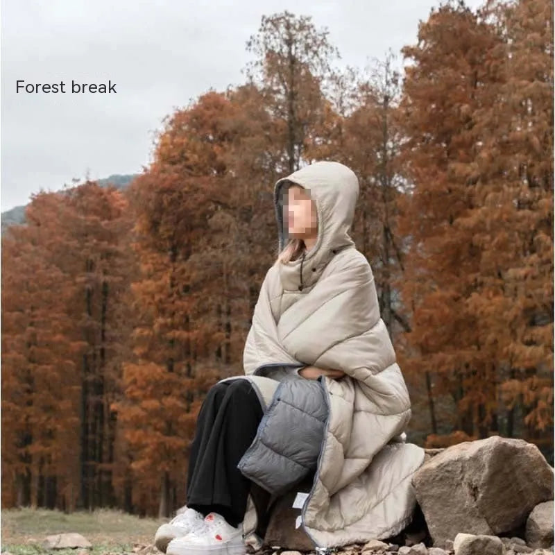Outdoor cloak sleeping bag worn as cape showing grey colour and 200x140cm dimensions