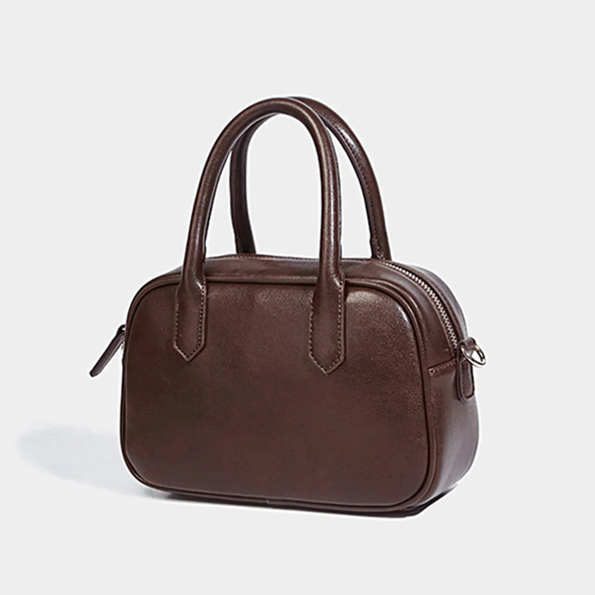 Retro small square PU leather messenger bag in black and coffee brown colours with a single adjustable strap.