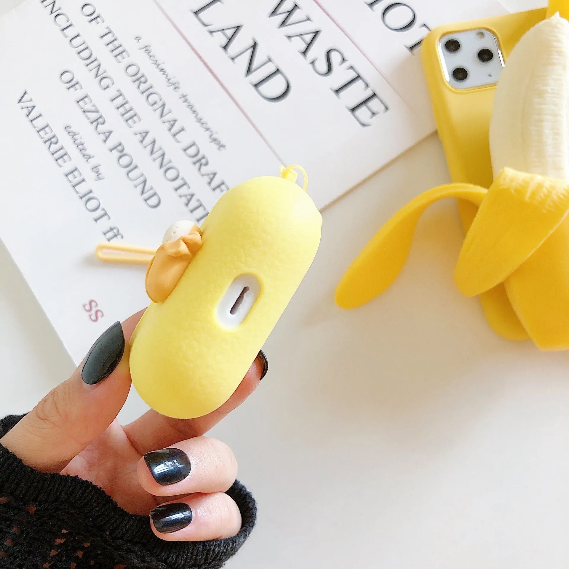 Yellow banana pattern back cover case for iPhone on a white background.