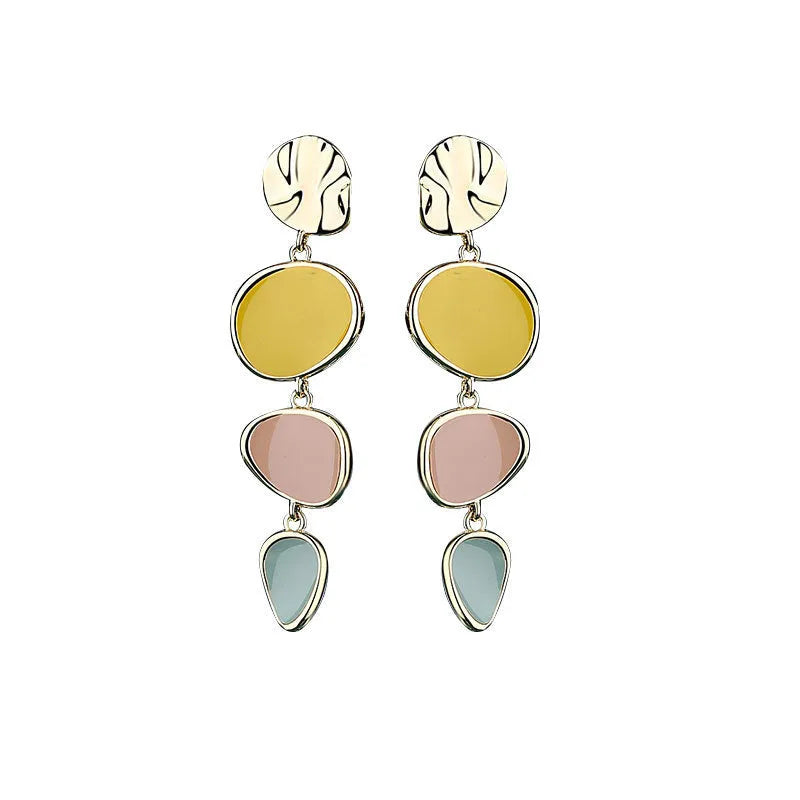 A pair of simple vintage wafer earrings in Morandi colours with a sterling silver needle post.