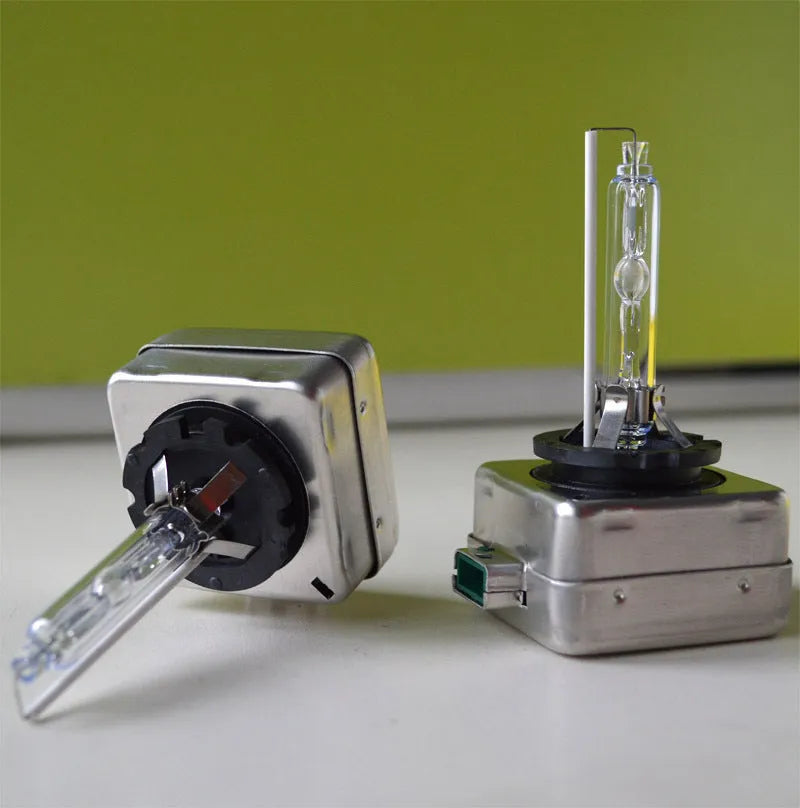 Xenon automotive headlight bulb with aluminium alloy shell and quartz tube, showing D1S and D1R base types.