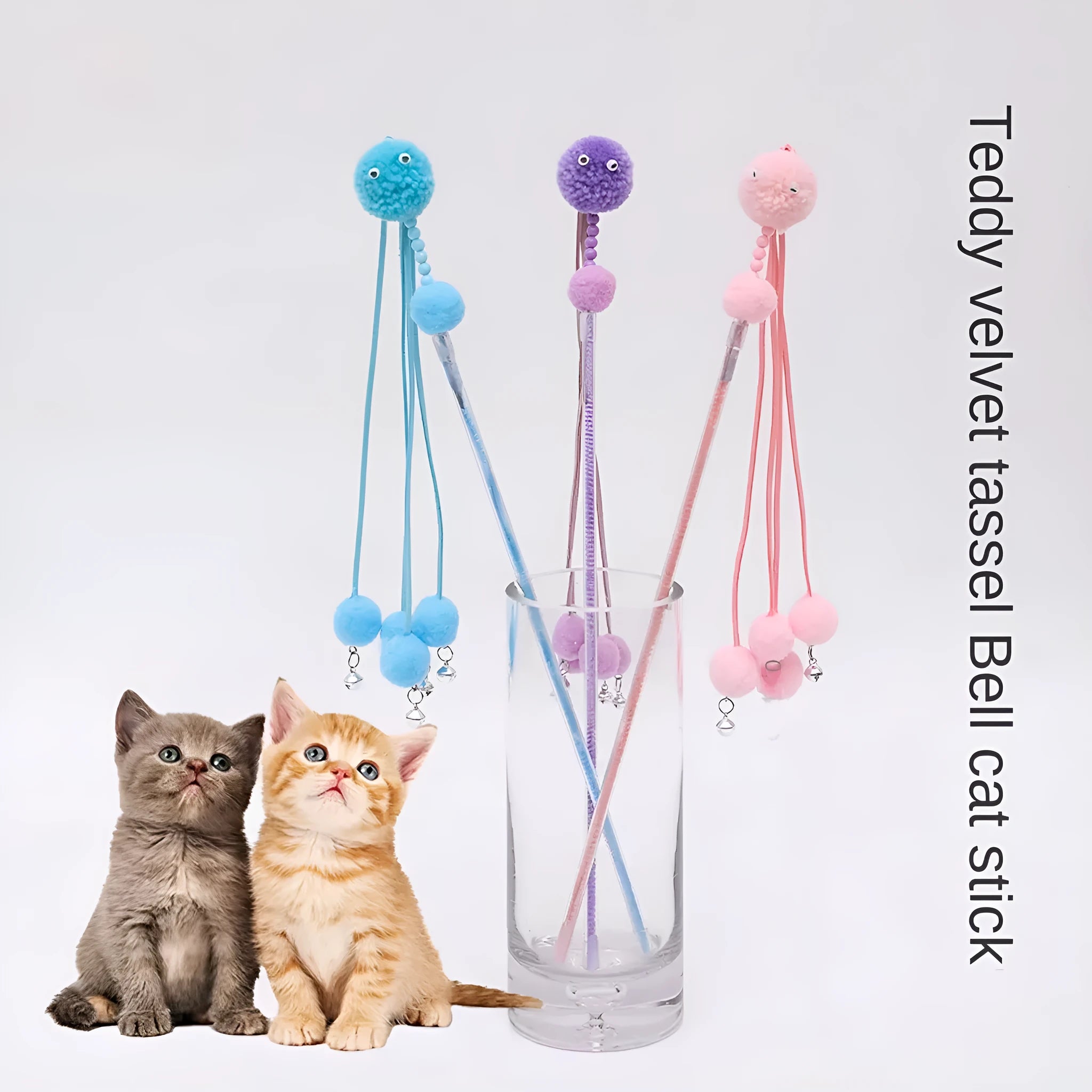 Colourful cat toy stick with a feather tassel on a foam handle in blue, pink, and purple options.