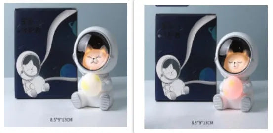 Resin bear-shaped starry sky night light with soft LED glow on a wooden table.