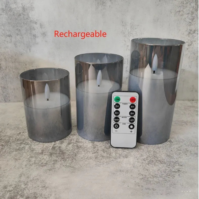 Set of three LED electronic candle lights in gold, gray, and white electroplated glass, sizes 7.5x10cm, 7.5x12.5cm, 7.5x15cm, with a remote control and USB cable.