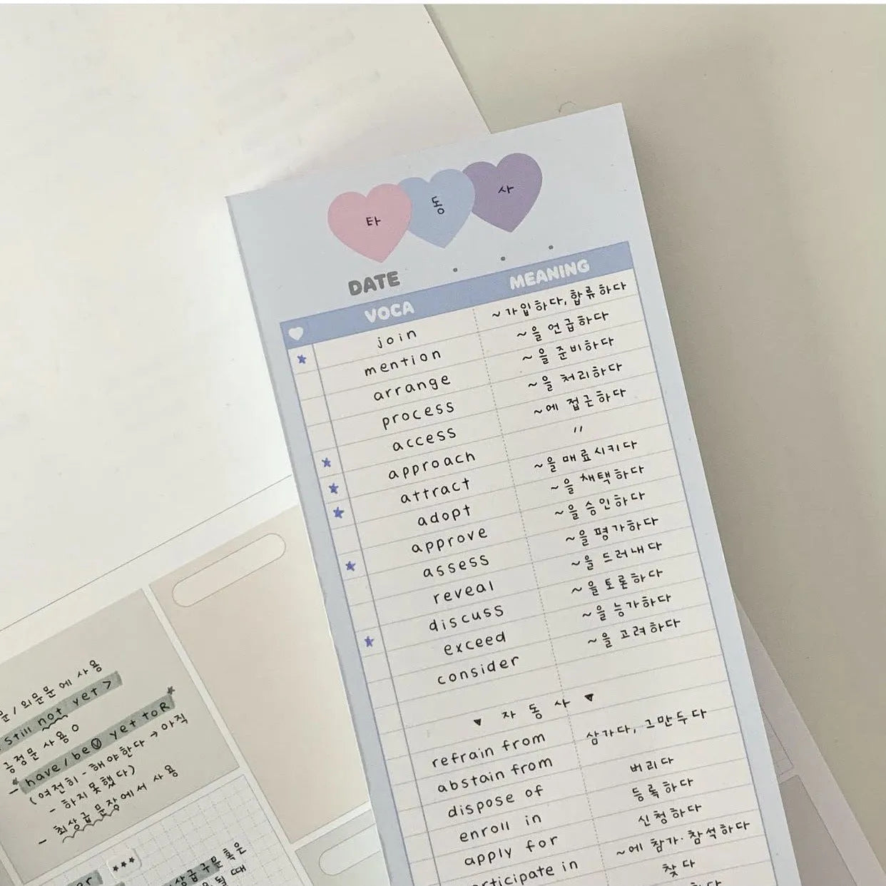 Vertical half-B5 notepad with blue cover, showing 30 pages for English word lists.
