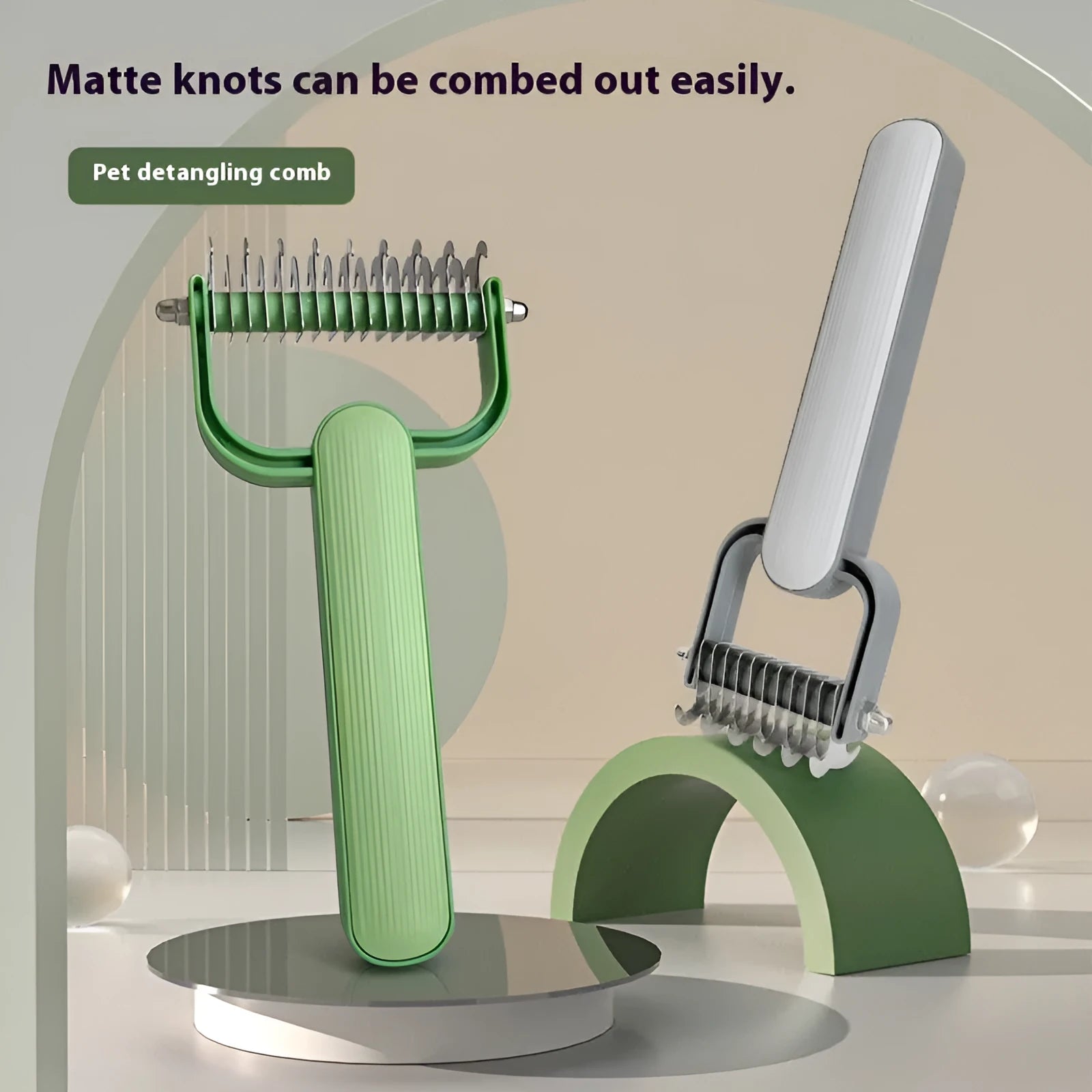 Green and grey dog de-matting combs in small and large sizes, showing angled stainless steel teeth.