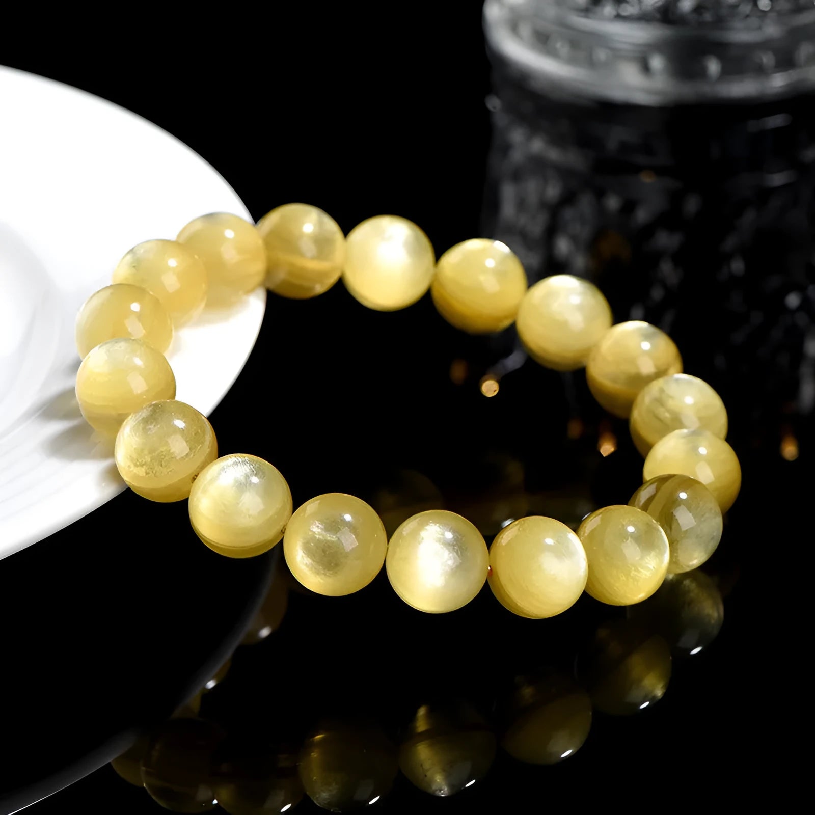Yellow golden dragon mica bracelet with polished round geometric beads on wrist