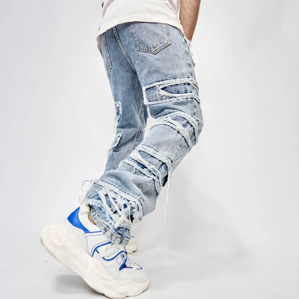 Men's blue cotton full length patched straight fit hip hop jeans on model