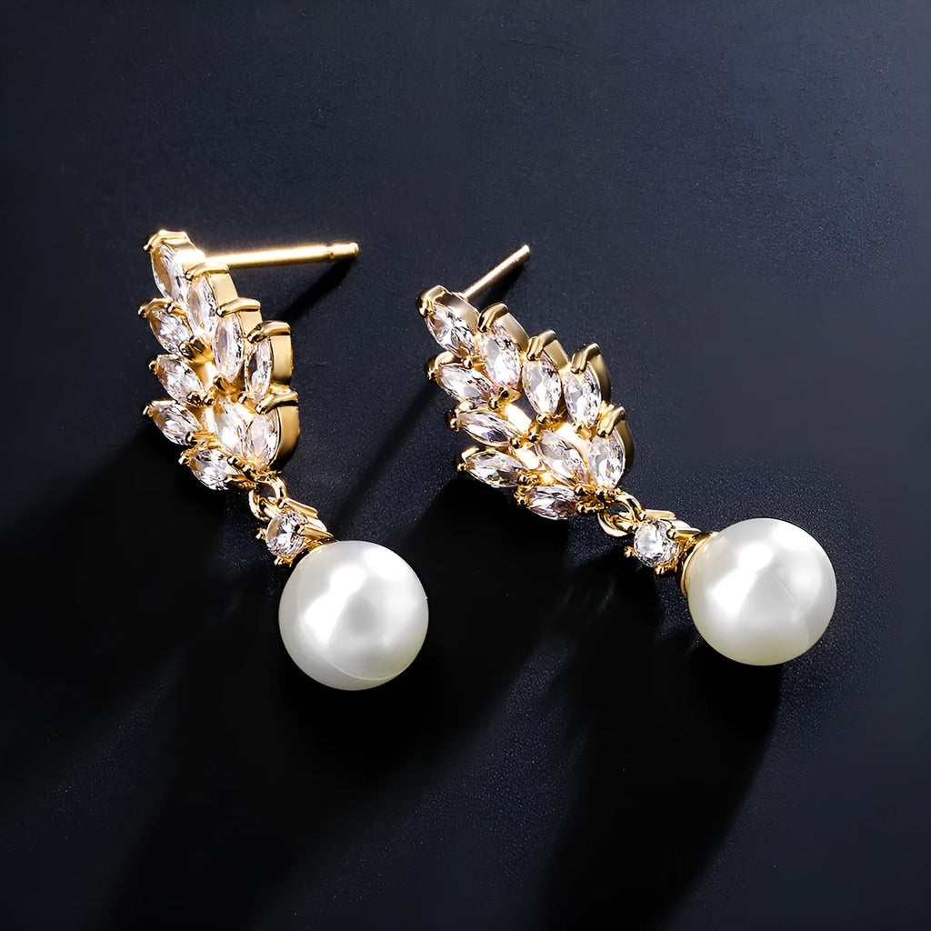 Geometric floral design earrings with micro inlaid zircon detail in gold, platinum, and rose gold finishes.