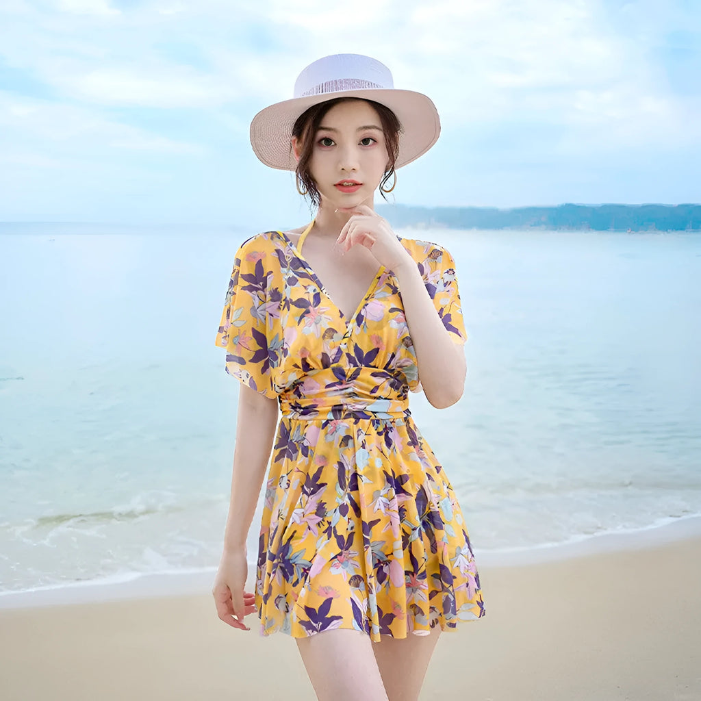 Yellow floral pattern women's one-piece polyester swimsuit on mannequin