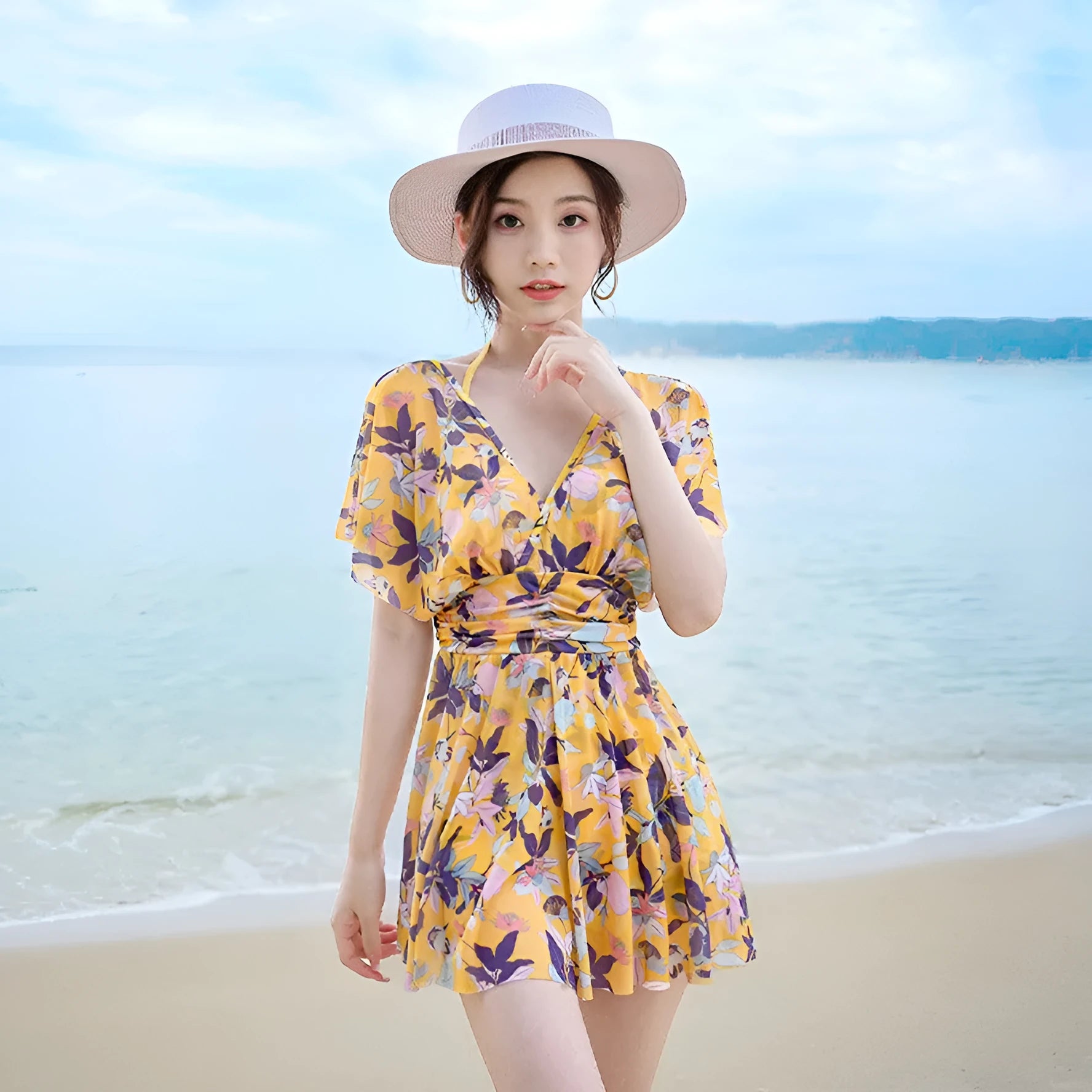 Yellow floral pattern women's one-piece polyester swimsuit on mannequin