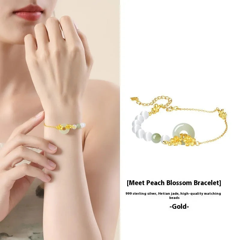 Pure silver peach blossom and safety buckle bracelet for women in New Chinese style, shown in electroplated gold tone.