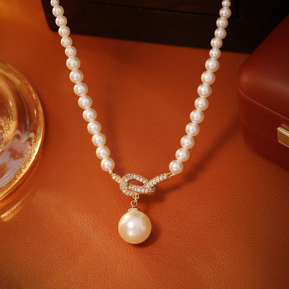 Knotted pearl pendant necklace with geometric brass micro inlay design for women