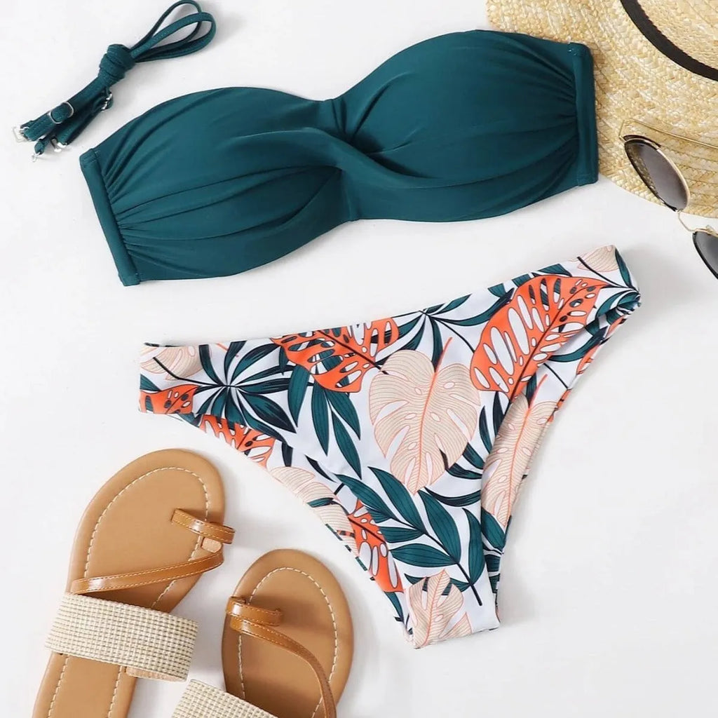 Green split push-up hard cup bikini top and coordinating briefs swimsuit laid flat.