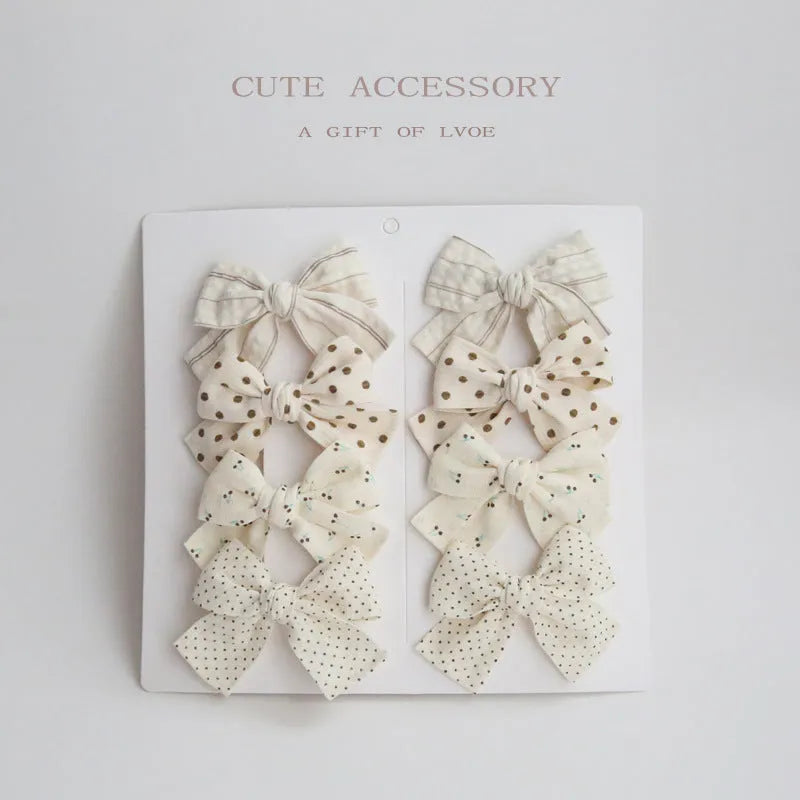 Dovetail bow hairclip set for children in cloth material with eight colour options