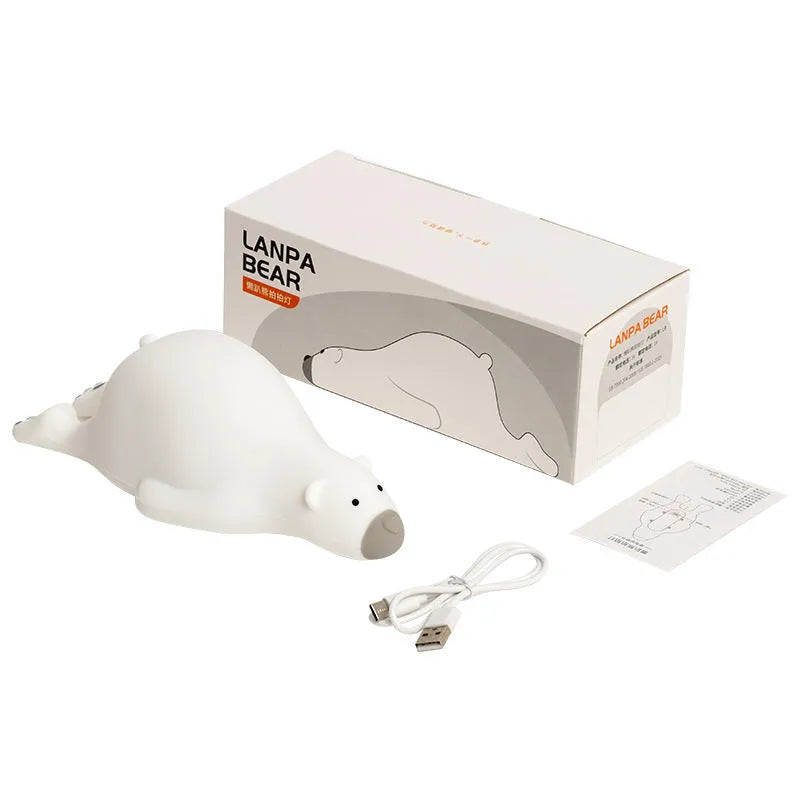 White bear silicone night light on bedside table with soft glow USB rechargeable children's lamp