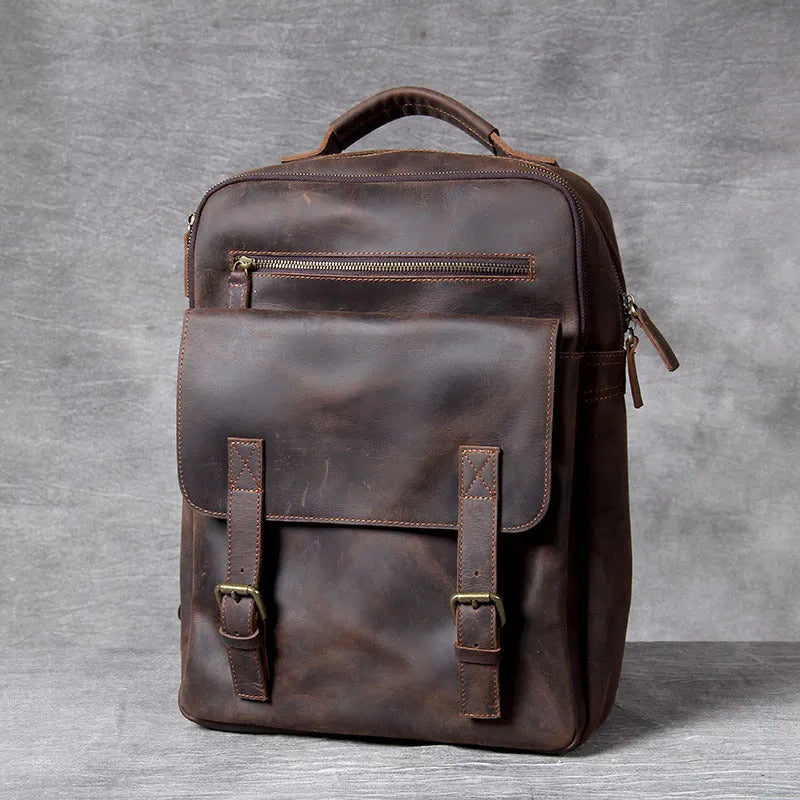 Dark coffee coloured handmade leather backpack with internal organiser compartments.