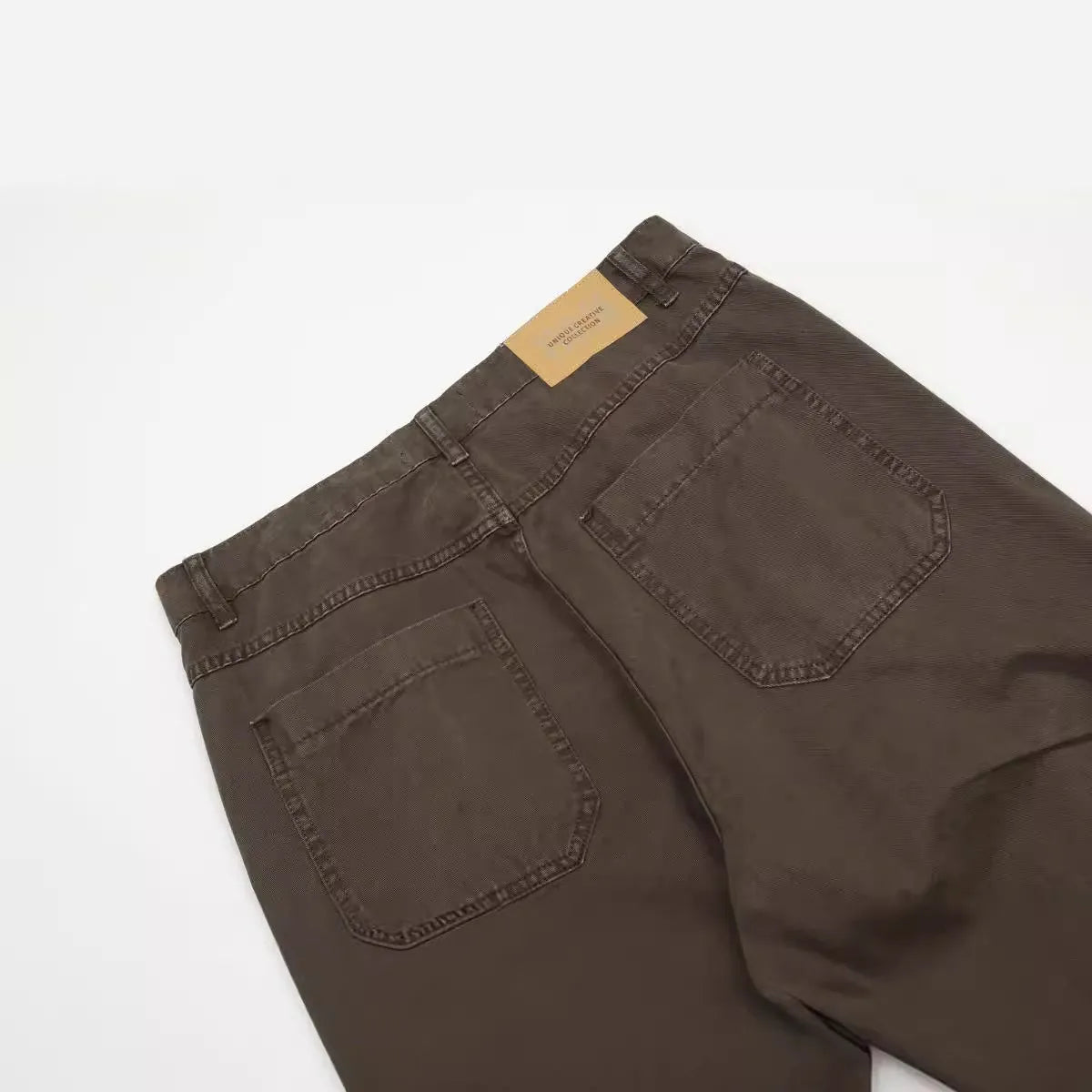 Men's loose straight-leg cotton trousers in brown colour with high waist and zip fly closure