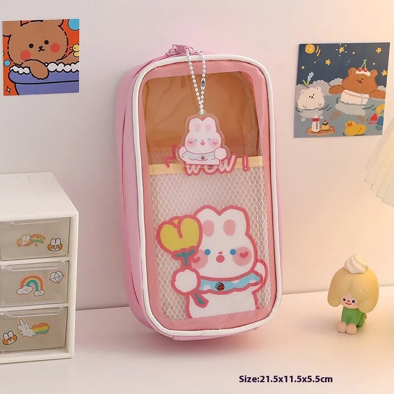 Transparent PVC student pencil case with Korean-style cartoon design showing stationery storage capacity