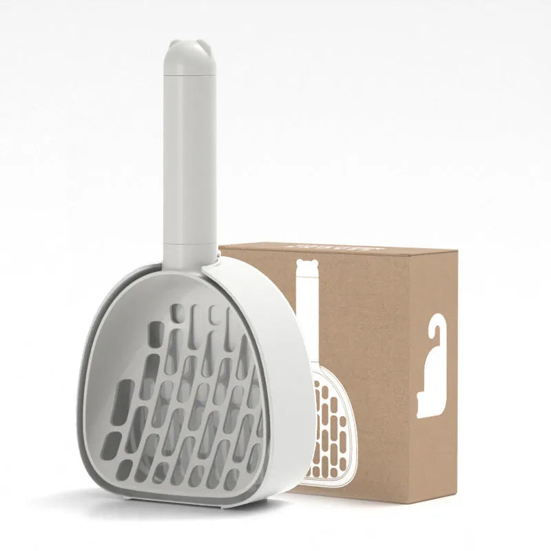 White ABS plastic cat litter scoop with a stand-up base and hidden bag storage compartment.