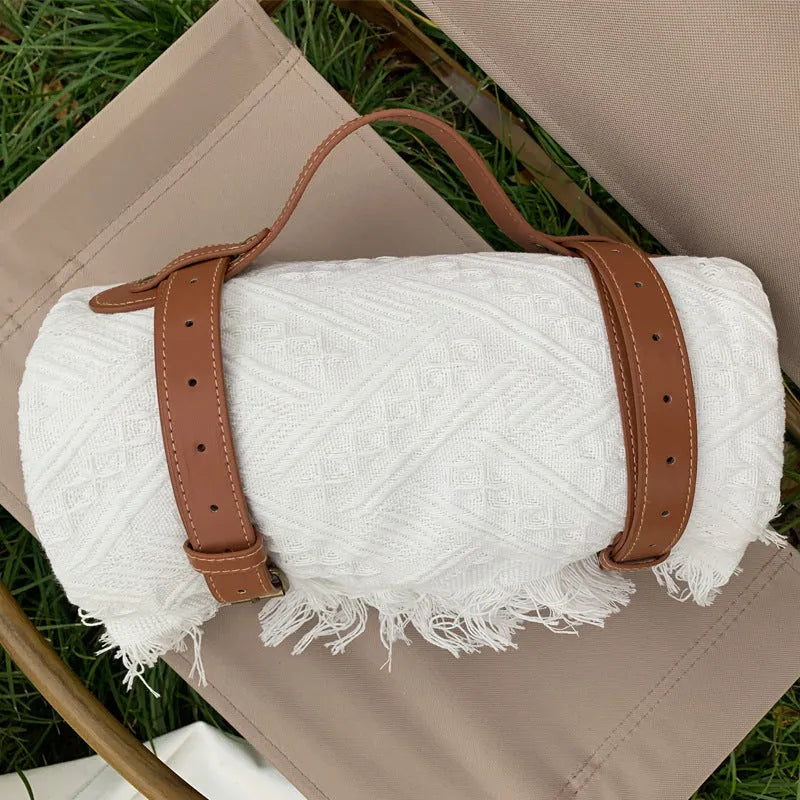 Chessboard plaid knitted picnic blanket with tassel edging and leather handle, acrylic camping rug