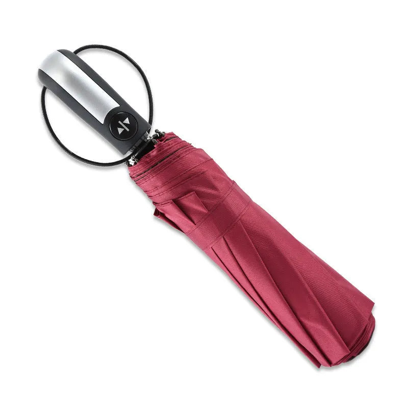 Black triple-fold automatic umbrella with palace-style canopy, shown open to demonstrate 110cm coverage.