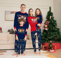 Family wearing matching red plaid Christmas pajamas with deer motif, including parents, children, and a dog.